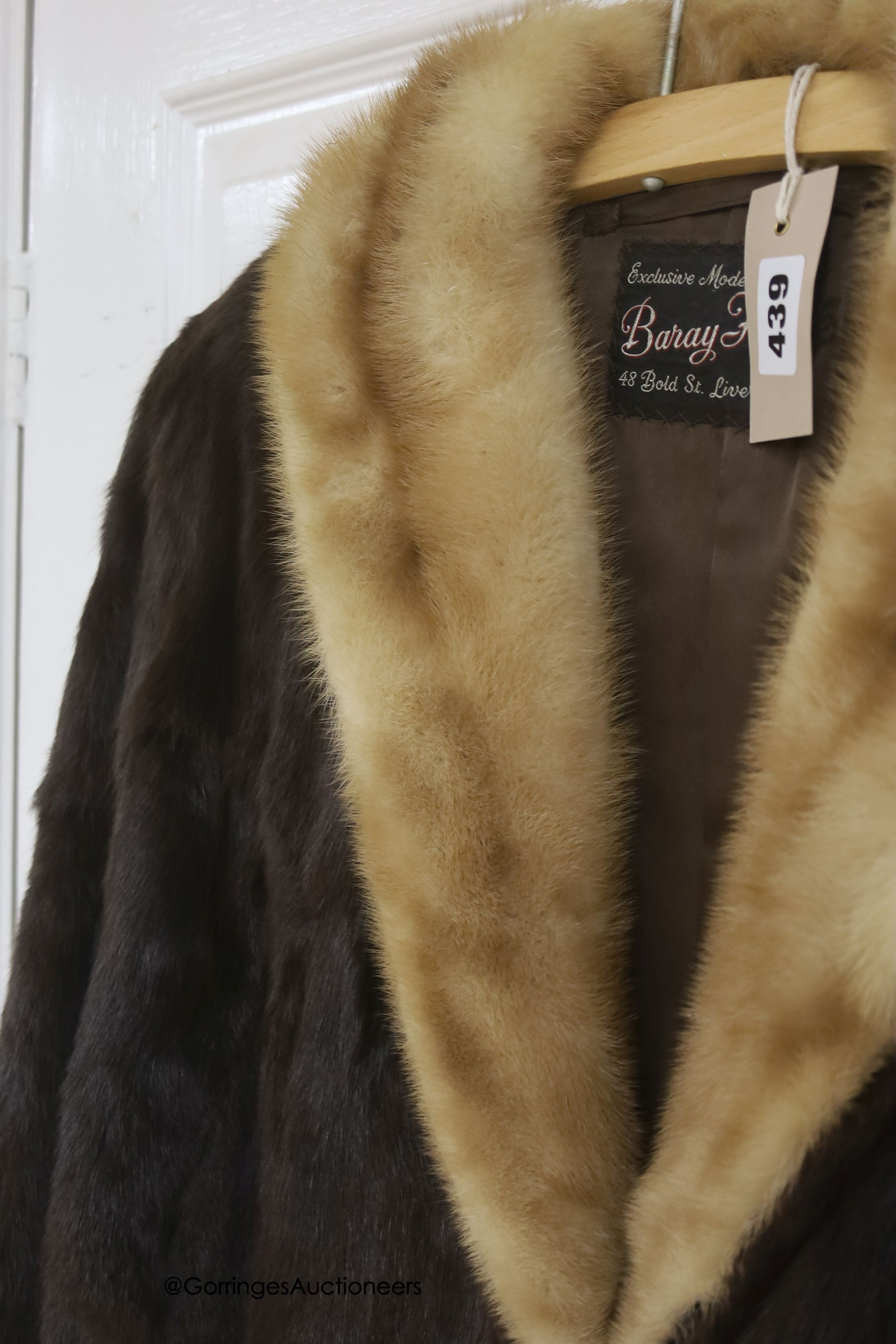 A ladies dark brown squirrel coat with blond mink collar by Baray Furs.